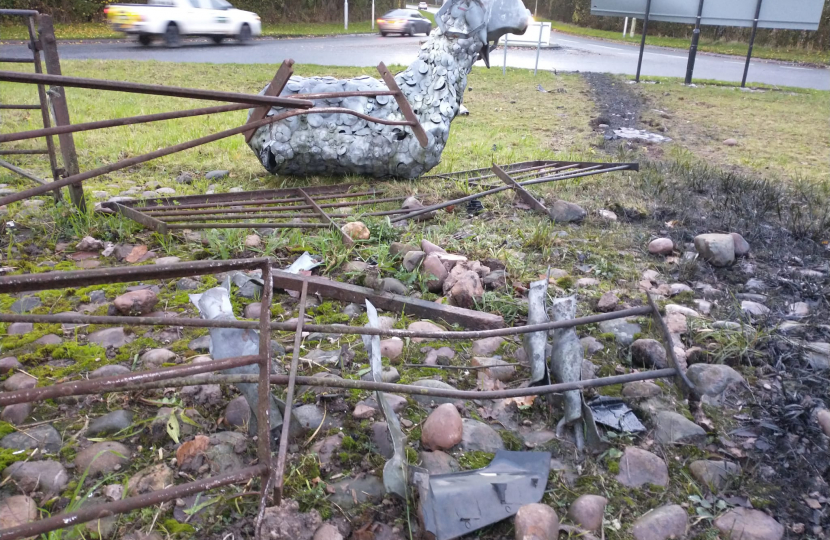 A metal sheep with demolished railings